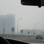 ...the famous Beijing smog makes the buildings somewhat difficult to see.