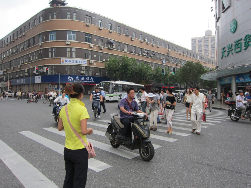 Crossing the street in China is fun. The light is green, but you still have to get through...